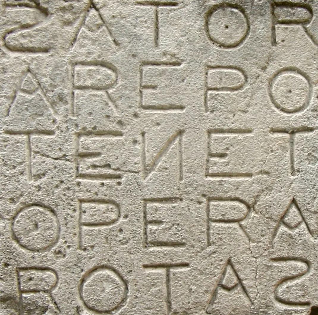 Sator square Sator Arepo Tenet Opera Rotas (word square, palindrome) in Oppède (France). The letters S and N are reversed as in an ambigram.